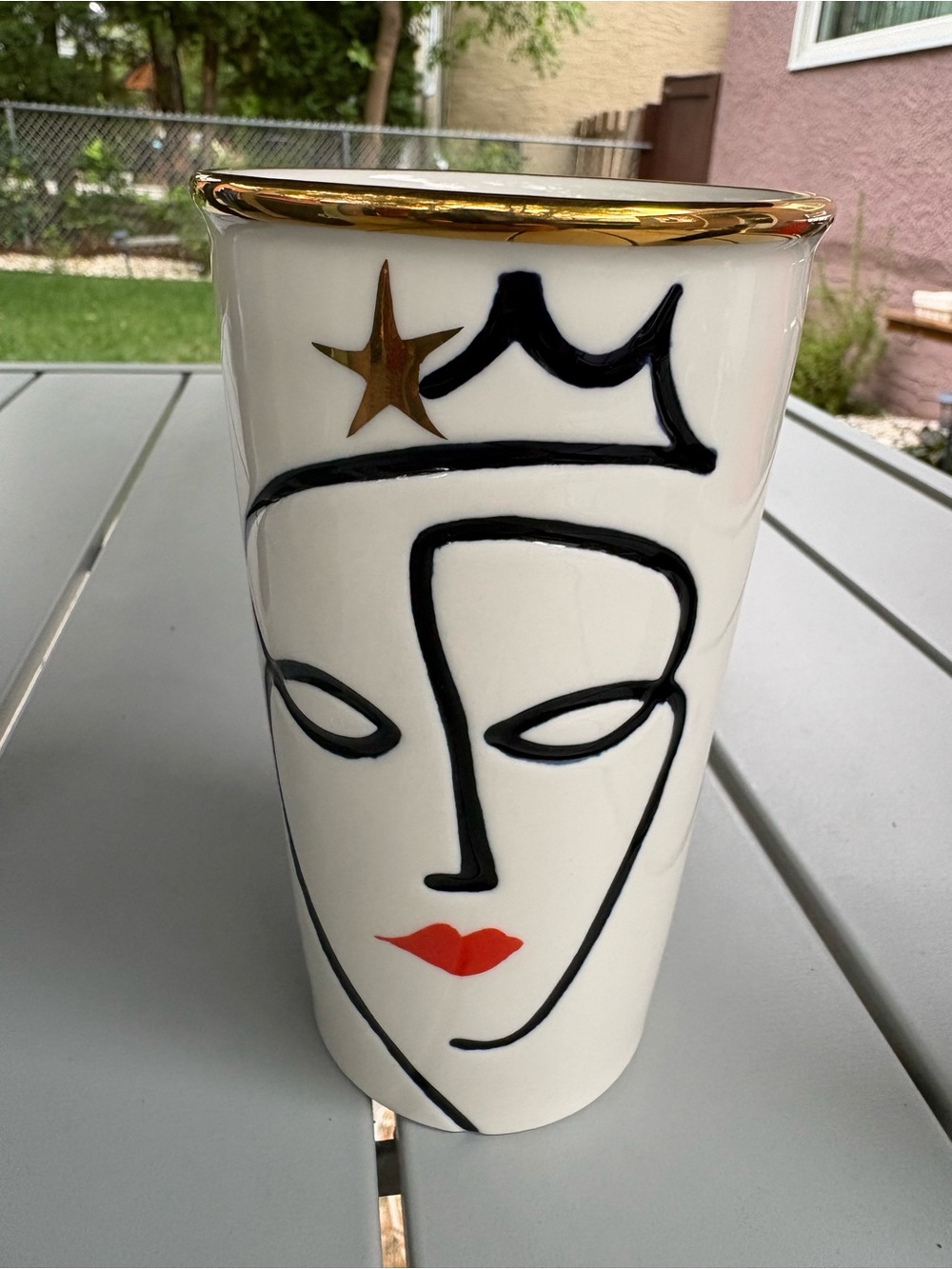 Starbucks 2015 Ceramic Tumbler with Black Face Line Art, Gold Rim & Red Lip